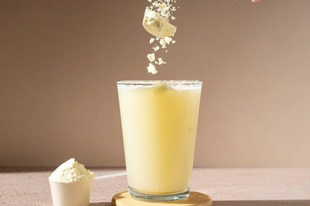 Pea protein powder being mixed into a beverage